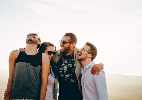 group of friends laughing during a fantasy football draft